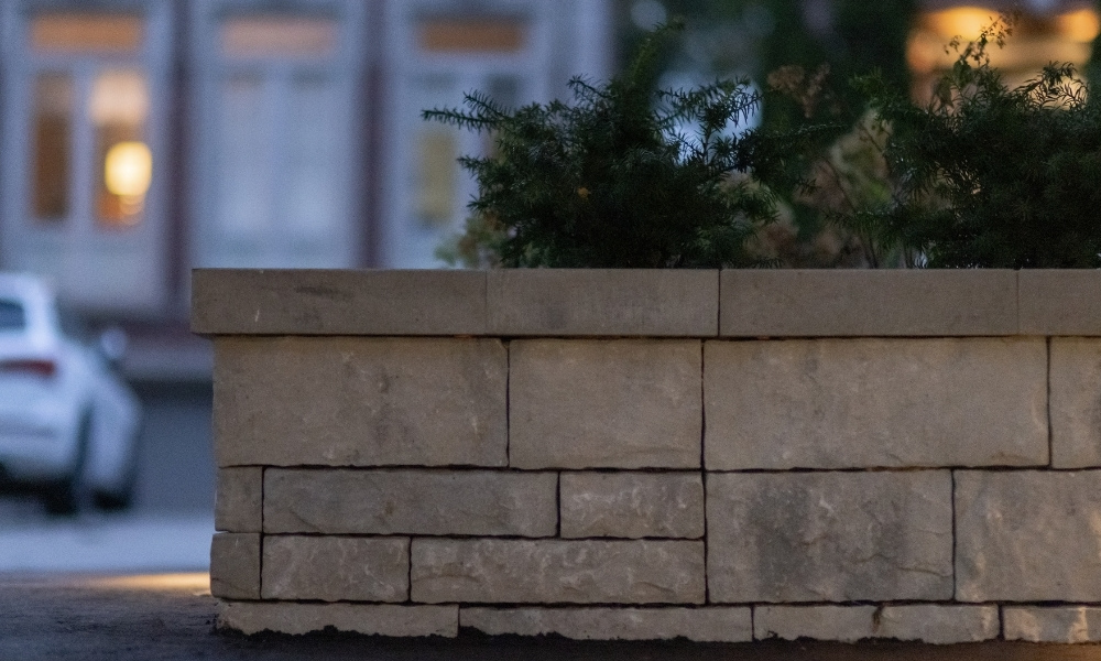 ahs custom retaining wall with glass railings lighting